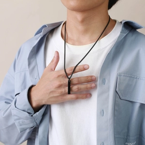 Minimalist black rectangle pendant necklace for men shown on a male model wearing casual clothes