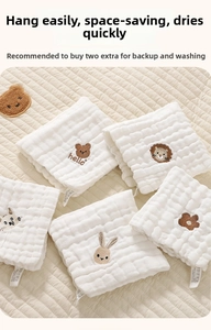 Close-up of white 6-layer cotton gauze baby handkerchief with cute animal embroidery
