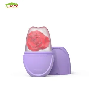 Purple facial ice roller detail showing frozen ice core with an embedded red rose flower