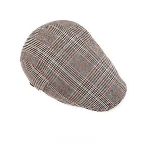 Overhead view of a classic plaid ivy cap featuring a black, white and orange tweed pattern