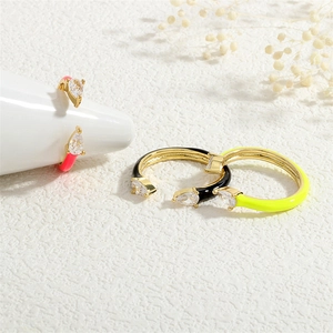 Detailed view of adjustable 18K gold plated rings with colorful enamel and pear cut zircons