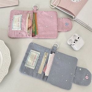 Detailed interior of blue and pink sequin star card wallets with zipper and card slots