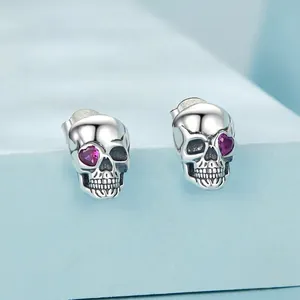 Gothic S925 sterling silver skull stud earrings with red heart shaped crystal eyes