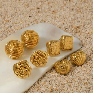 Gold stainless steel earring set featuring textured heart, flower, and square designs