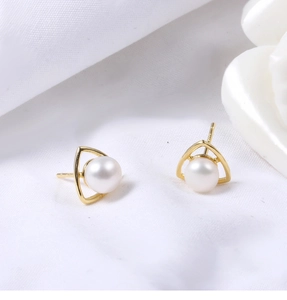 Detail of S925 silver triangle earrings featuring natural white freshwater pearls