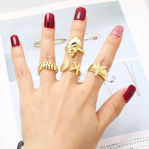 Gold-plated ocean theme ring set featuring starfish shell and fishbone motifs