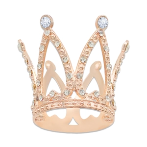 Macro detail of rose gold crown ring with sparkling crystals and twin round main stones