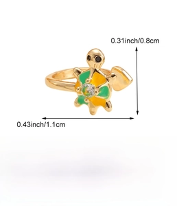 Detailed view of turtle open ring with yellow-green enamel and clear zircon inlay
