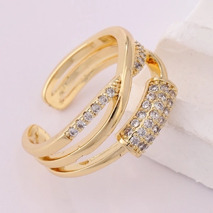 Close-up of a 18K gold-plated multi-layer crossover ring with shimmering zircon stones