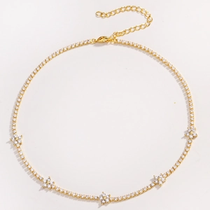 Elegant gold-plated flower necklace with micro-paved cubic zirconia on white background