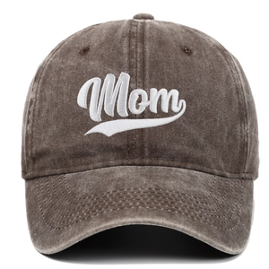 Close-up of white Mom embroidery on a washed brown cotton baseball cap detail