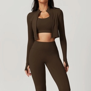 Close-up of chocolate brown yoga set featuring high-waist leggings and thumbhole sleeves