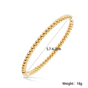 Detailed macro of 18K gold plated beaded bangle showing 18g weight and size parameters