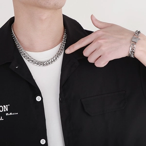 Men's silver titanium steel Cuban link chain necklace and bracelet set on model