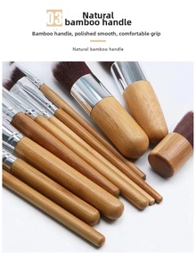 Detail view of natural bamboo handles and soft bristles on professional makeup brushes