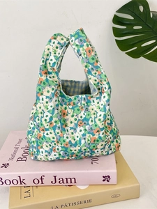 Floral corduroy wrist bag with plaid lining for lunch or small items on books