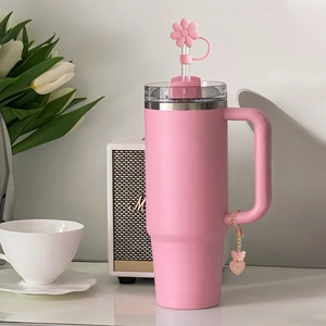 Pink tumbler for Stanley with flower straw cover and gold letter G heart charm