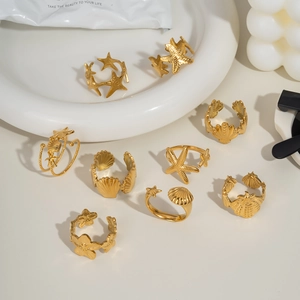 Ensemble de bagues en acier doré thème océan avec motifs étoile de mer et coquillage