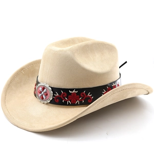 Detail of light beige suede cowboy hat featuring red wavy embroidery and vintage silver buckle