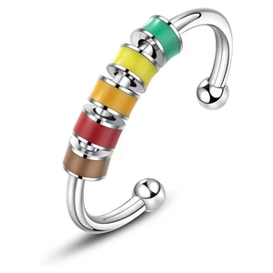 Detailed macro shot of silver anxiety cuff bangle with five colorful rotating beads