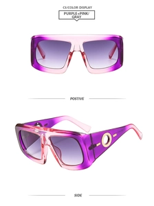 Detail view of square gradient pink sunglasses with gold circular metal temple accents