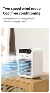 Detail of USB mini air cooler with digital display and dual mist nozzles on wood surface