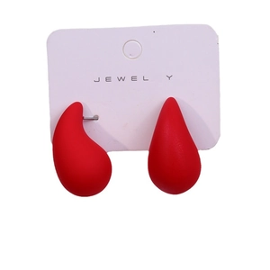 Minimalist red teardrop earrings on a white jewelry card with vibrant acrylic finish