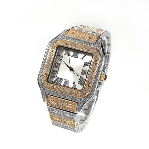 Detail of square iced-out watch with Roman numerals and gold-silver two-tone band