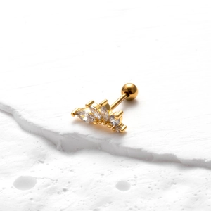 Detailed view of a gold curved tragus stud earring with marquise and round zircons