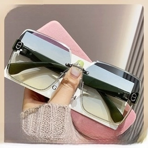 Detail of rimless gradient butterfly sunglasses with gold CD metal logo on temple