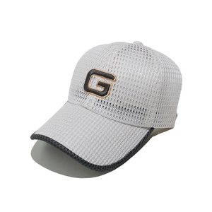 Close-up of breathable mesh baseball cap featuring embroidered G letter logo patch