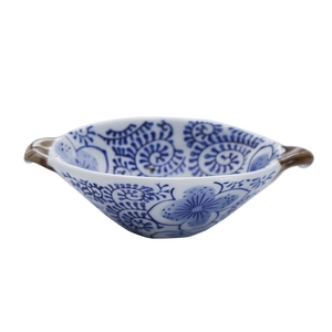 Ceramic oval salad bowl with dual handles and blue floral patterns on white porcelain