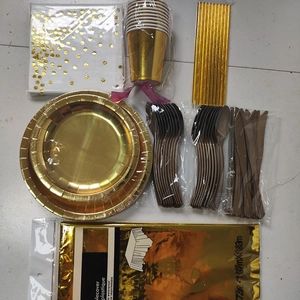 Gold polka dot party supplies set with paper plates cups and waterproof tablecloth
