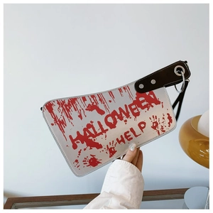 Detail of cleaver-shaped handbag with Halloween Help text and realistic red blood splatter