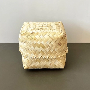Macro view of natural woven bamboo storage box showing intricate handmade texture