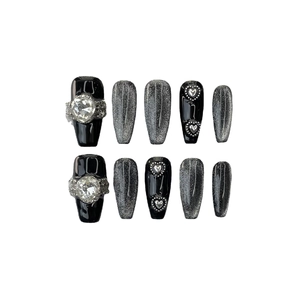 Handmade black cat-eye press-on nails with heart crystals and silver glitter in ballet style