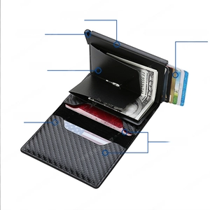 Detail view of carbon fiber RFID wallet showing pop-up card mechanism and cash clip