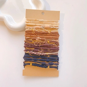 Detail of high-elastic multi-colored hair ties set with woven textures and metal beads