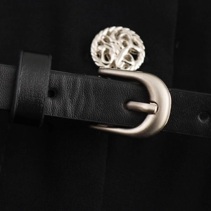 Elegant sleeveless black jumpsuit for women featuring a leather belt with silver buckle