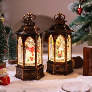 Close-up of retro bronze Christmas lanterns with snowmen and Santa Claus micro scenes