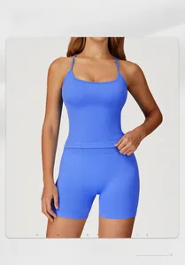 Detail of blue-purple ribbed yoga set showing cross-strap tank top and high-waist shorts