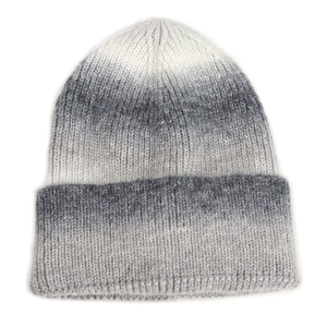 Detailed knit texture of white and grey gradient thick woolen beanie for winter