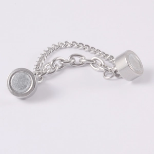 Detailed view of silver magnetic chain connector with polished links on white background