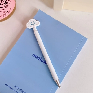 Close-up of white retractable gel pen featuring a cute blue smiling cloud top decoration