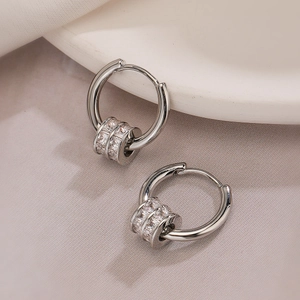 Modern silver circular earrings with cubic zirconia beads in a stylish minimalist design