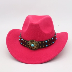 Detail of fuchsia wool western hat with turquoise beads and bronze sun buckle
