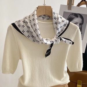 Elegant floral print square silk scarf paired with a cream short-sleeve knit sweater
