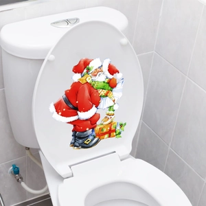 Close-up of Santa Claus themed waterproof PVC sticker applied on a white toilet lid