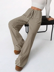 Detail shot of brown and white striped knit wide-leg pants with drawstring waist