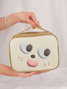 Detailed view of the cute cartoon makeup bag handle and waterproof PU leather material